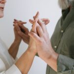 Close-up of an elderly couple lovingly holding hands, symbolizing enduring love and connection.